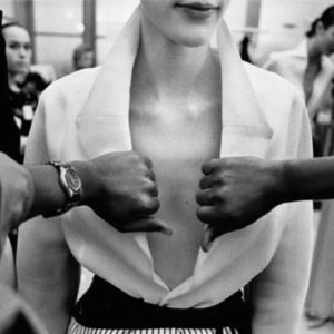 Abraham Pelham Haute Couture 1999 by Gérard Uféras, model in low cut white collar shirt, two hands holding the shirt