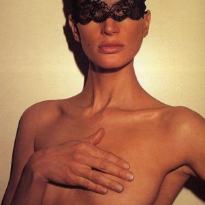 Kristen McMenamy, Paris by Roxanne Lowit, portrait of nude model in black lace mask, covering her breasts with her hand