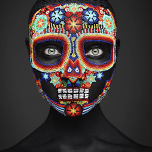 Epitaph II by Rankin, portrait of Model with colorful skull mask made of small beads
