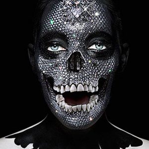 Memento Sparkling Mask, portrait of model with crystal covered facce to look like a skull with real teeth