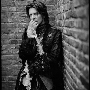 david bowie, in my stairwell by Mark Seliger, portrait of the singer, leaning against a brick wall