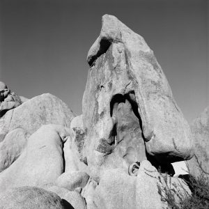 Guido Argentini, Thea, Bending on a Stone, Nude in Nature, Landscape, outdoor, black and white, black and white photography, rocks, nature, fine art photography, limited edition