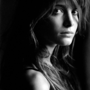 Stephanie Seymour III. 1989 by Antoine Verglas, black and white Portrait of the model with loose hair