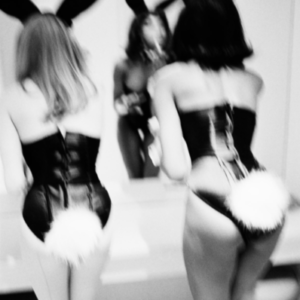Playboy Bunnies by Ellen Von Unwerth, blurry image of two models in bunny costumes fixing their makeup in a mirror