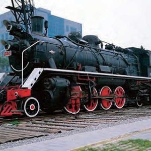 Decorated with the Locomotive by Liu Boilin, person painted to match the ols black and red steam locomotive in the back