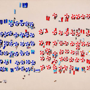 South Beach by Tony Kelly, red blue and white parasols and sunbenches