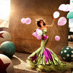 Circus II by Kristian Schuller, model in gren and pink mermaid dress with pink and green balloons