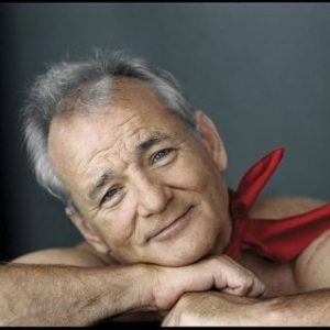 Bill Murray by Mark Seliger portrait of the actor wearing a red bandana around his nack, leaning his head on his arms