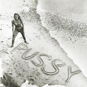 Pussy Galore James Bond by Terry O'Neill, woman in bikini standing on the beach
