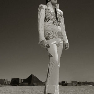 Brendan Paul as Elvis - Las Vegaws 2000 by Albert Watson, the elvis impersonator standing in full costume in front of the memphis pyramid