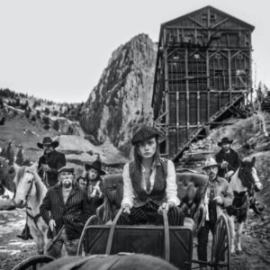 The Shift by David Yarrow, wild west szene of a traveling group with horses