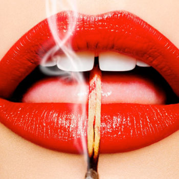 smoking lips by Tony Kelly, red lips holding a burnt out match