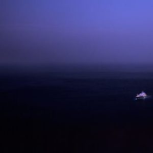 The escape by David drebin black and purple night landscape with purple light in the distance