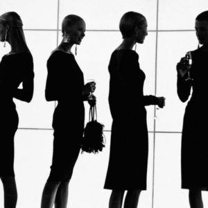 Valentino Haute Couture by Gérard Uféras, the silhouettes of models in short dresses holding champagne glasses