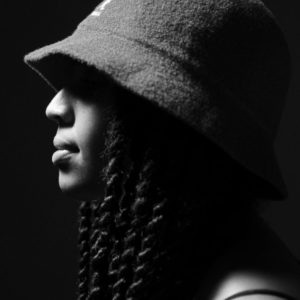 Afropunk by Marc Baptiste, black and white sideprofile with rope twists and bucket hat