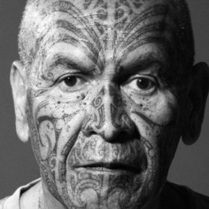 Aniwa Gathering I by Marc Baptiste, black and white portrait of a man with maori face tatoos