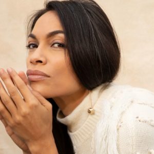 Rosaria Dawson by Marc Baptiste, portrait of the sctress in white knitwear