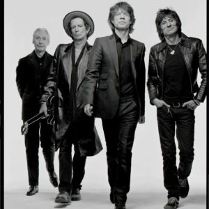 The Rolling Stones by Mark Seliger, black and white portrait of the band walking towards the camera