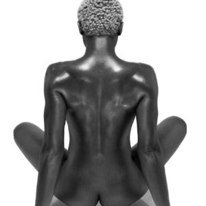 Female Buddha by Sylvie Blum, black model from the back, sitting crosslegged