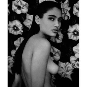 Brenda, Milan by Bruno Bisang, nude in front of a flower wallpaper