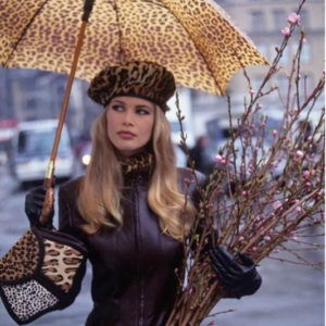 Claudia Schiffer Leopard by Arthur Elgort, the model in leather jacket with leopard print accessoirs, holding cherry twigs