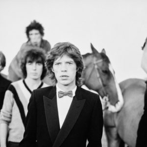 The Rolling Stones by Arthur Elgort, portrait of the Band with two horses
