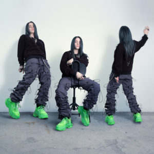 Billie Eilish Triptych by Markus Klinko, the singer three times in black with neon green shoes