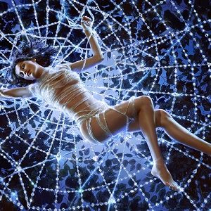 Laetitia Casta by Markus Klinko, the actress lying in a crystal spiderweb