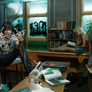 Tommy Lee, the classroom by Markus Klinko, the Rockstar in a messy classroom with scossors in hand and two girls