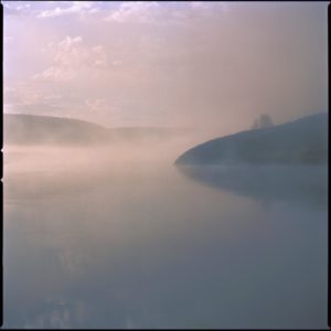 yellowstone 17 by Nigel Parry, lake and hills in purple fog