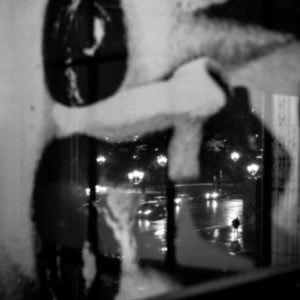 Grandpalais by Gérard Uféras double exposure of a painted face and citylights