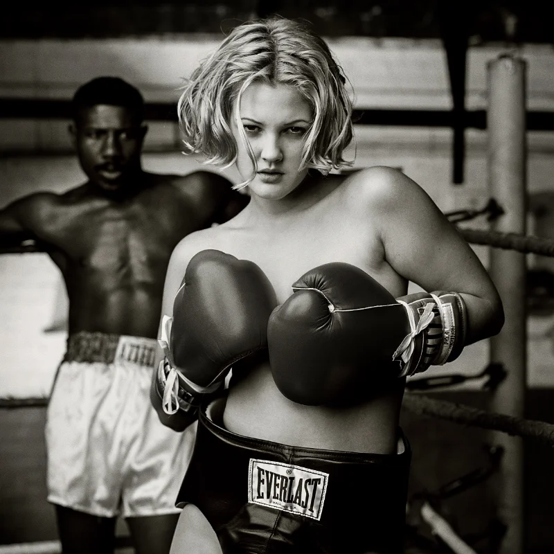 Mark Seliger, Drew Barrymore Boxing 1993, black and white topless portrait in boxing gloves