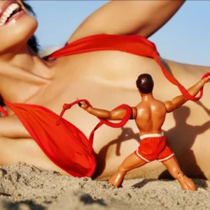 Tony Kelly, Beach Boy, Closeup, Beach, Puppet, Barbie, Doll, Woman, Model Nude, Bikini, Summer, Sun, light, Color, Red, Color Photography, limited edition, fine art photography