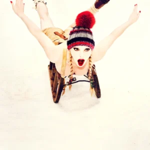 Ellen von Unwerth, Heimat, Snow, Bavaria, Mountains, Sled, Sledding, Model, Woman, Red Lips, Lederhose, Winter, Fun, Sexy, Fine art photography, limited edition, color, color photography