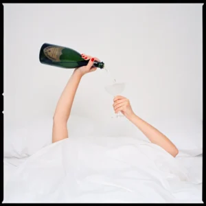 Tyler Shields, Champagne Hands, Funny, Bed, Bedside, Glass, Party, Minimal art, simple, fine art photography, color, color photography, limited edition, woman, model